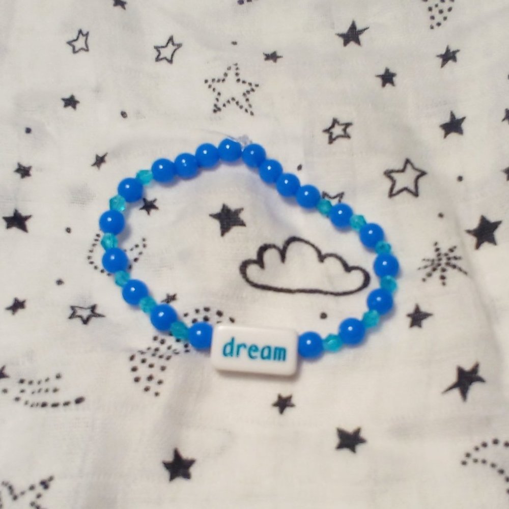 Handmade dream bracelet with little blue beads.